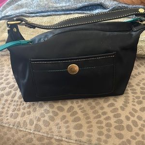 Black cloth Coach mini bag.